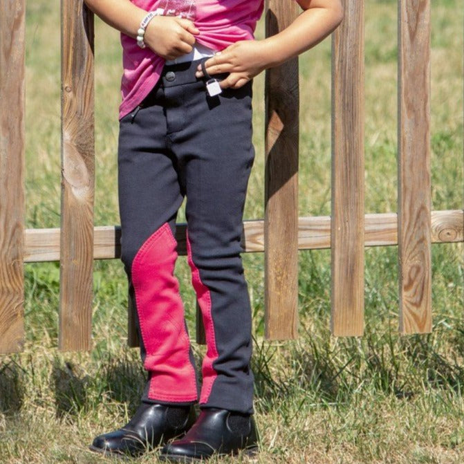 Pantalon d'équitation pour enfant HKM My First marine et fuchsia porté
